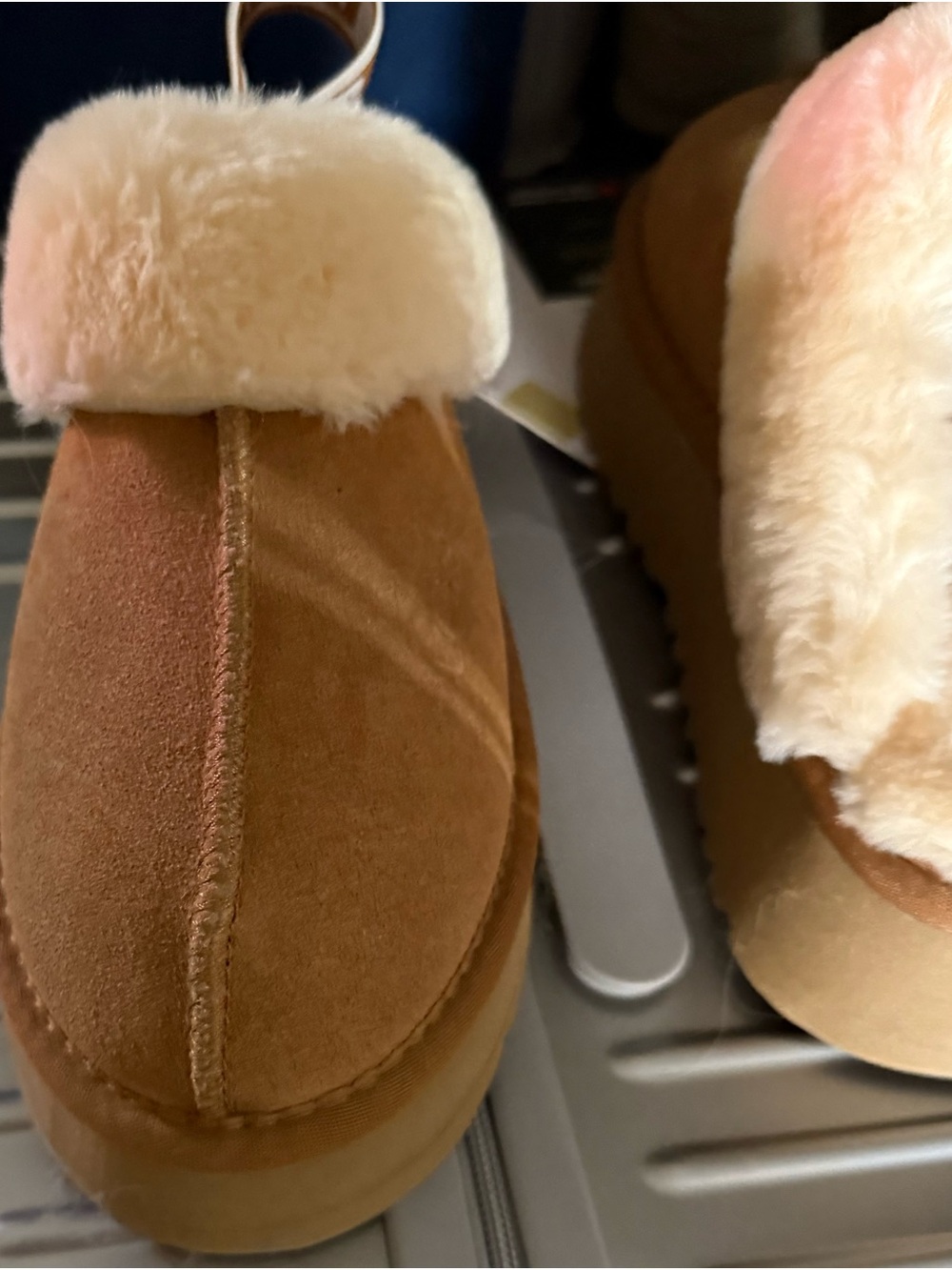 Ugg shoes with an elevated heel with a backstrap